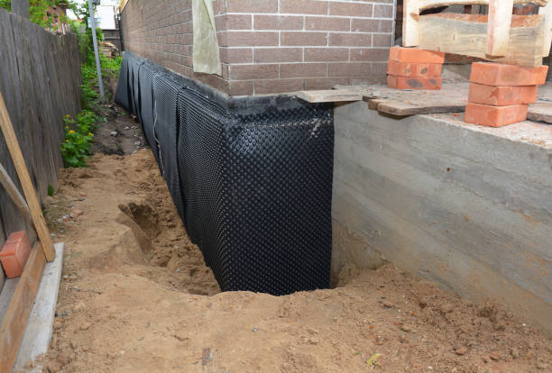 SJ Waterproofing Pros technician performing targeted Interior Drainage System assessment in Bourneville, OH